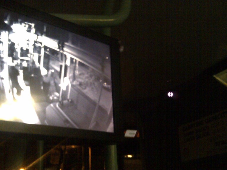Evening bus journey home from a birthday barbecue; photograph of the CCTV monitor (with the infrared camera showing up a lot brighter than it appeared to the naked eye in the top right of frame).